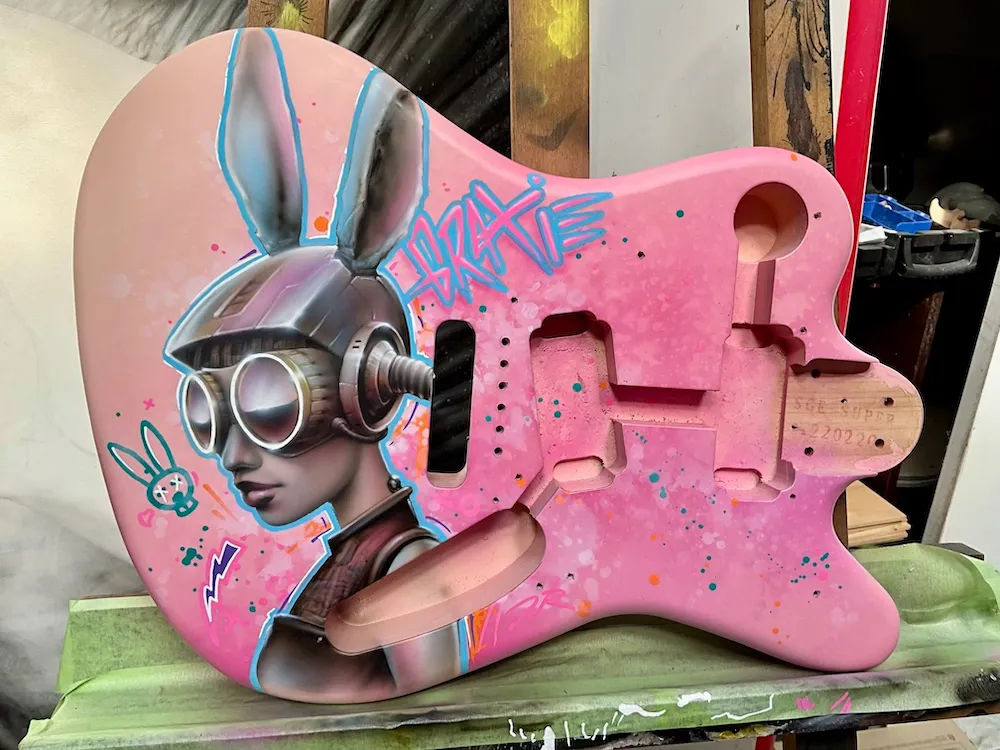 Shell Pink Squier Super-Sonic guitar with custom airbrush artwork